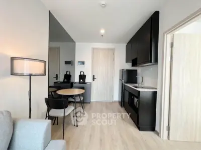 Modern apartment interior with sleek kitchen and cozy dining area