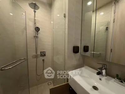 Modern bathroom with glass shower and sleek sink design