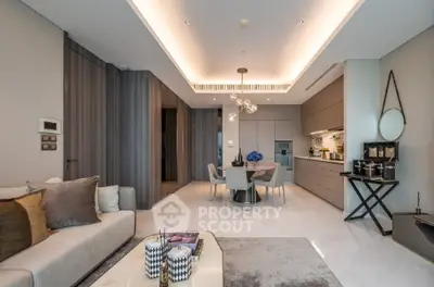 Luxurious open-plan living room with modern kitchen and elegant decor