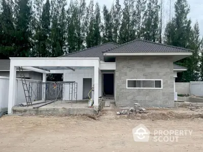 Modern single-story house under construction with sleek design and spacious layout.