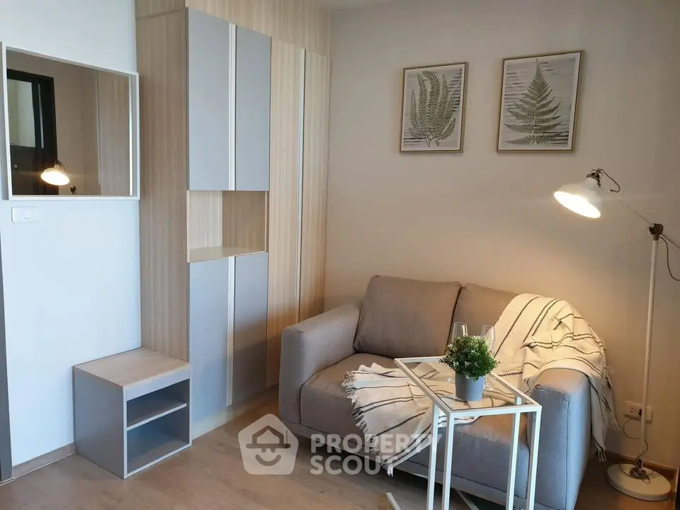 Modern living room with cozy sofa, stylish decor, and natural light, perfect for relaxation and comfort.