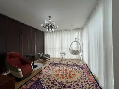 Elegant living room with modern decor and large windows