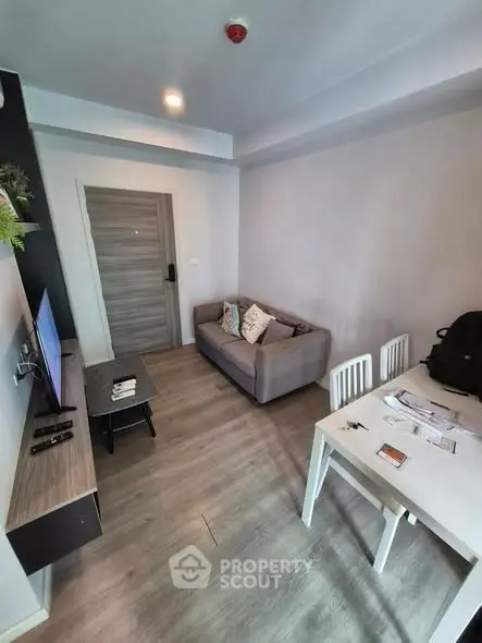 Modern living room with sleek furniture and stylish decor in a cozy apartment.