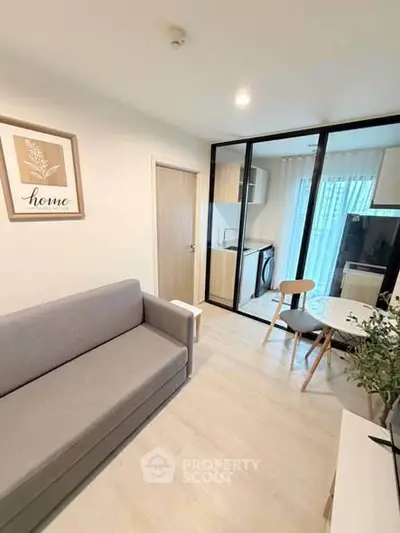 Modern living room with glass partition and cozy decor