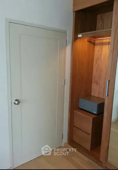 Modern wooden wardrobe with built-in safe and sleek design