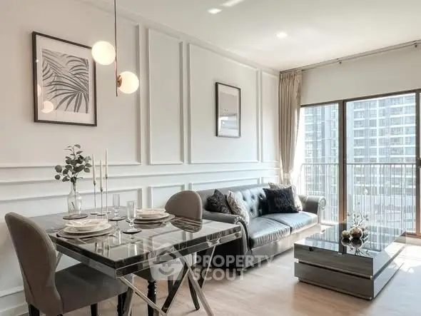 Elegant living room with modern decor and large windows offering city views.