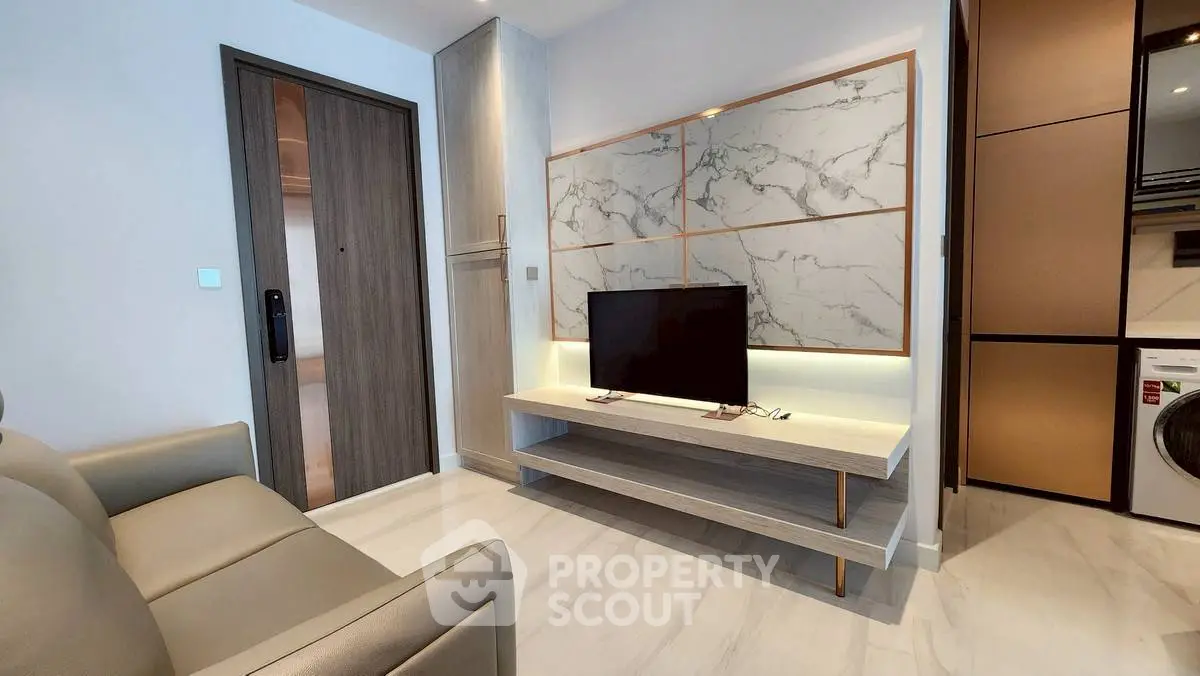 Modern living room with sleek TV stand and marble accent wall