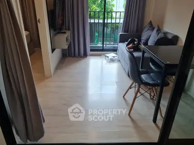 Modern living room with balcony view and sleek furniture