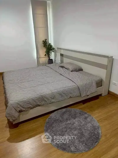 Modern bedroom with stylish bed and cozy decor