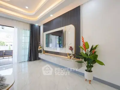Luxurious modern living room with elegant decor and large TV, featuring stylish ceiling lights and glossy flooring.