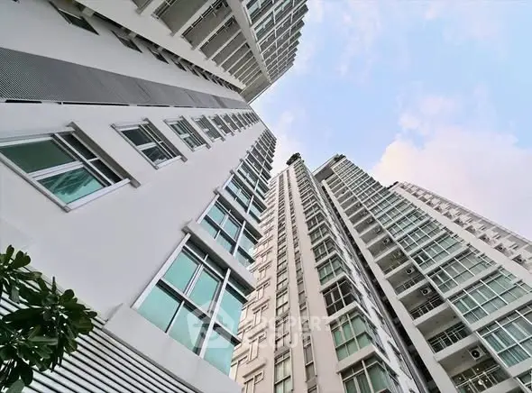 Stunning high-rise residential building with modern architecture and expansive windows.