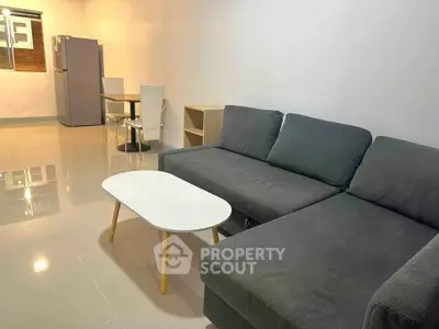 Modern living room with sleek gray sofa and minimalist decor