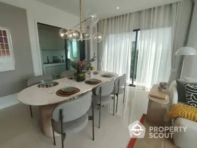 Elegant dining area with modern chandelier and natural light