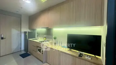 Modern kitchen with sleek cabinetry and built-in appliances in a stylish apartment.