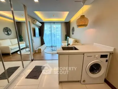 Modern living room with washing machine and stylish decor