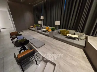 Modern living room with stylish seating and ambient lighting