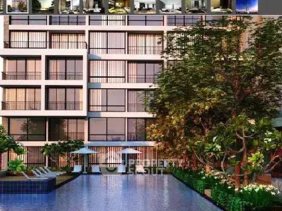 Modern apartment building with pool and lush garden, perfect for luxury living.