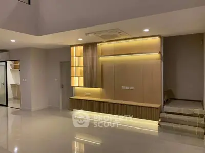 Modern living room with sleek built-in lighting and minimalist design