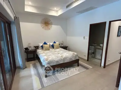 Luxurious bedroom with ensuite bathroom and elegant decor