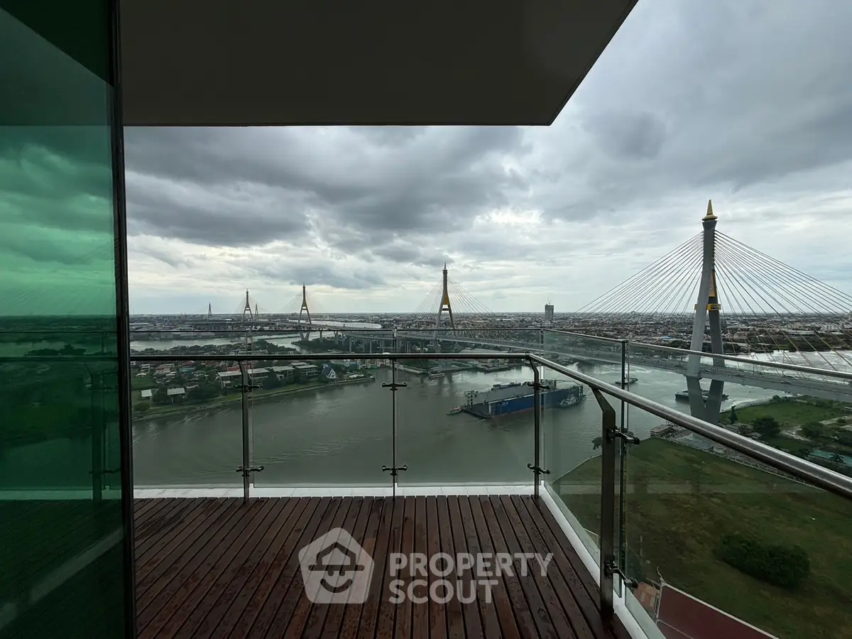 Stunning balcony view of river and iconic bridge from high-rise apartment