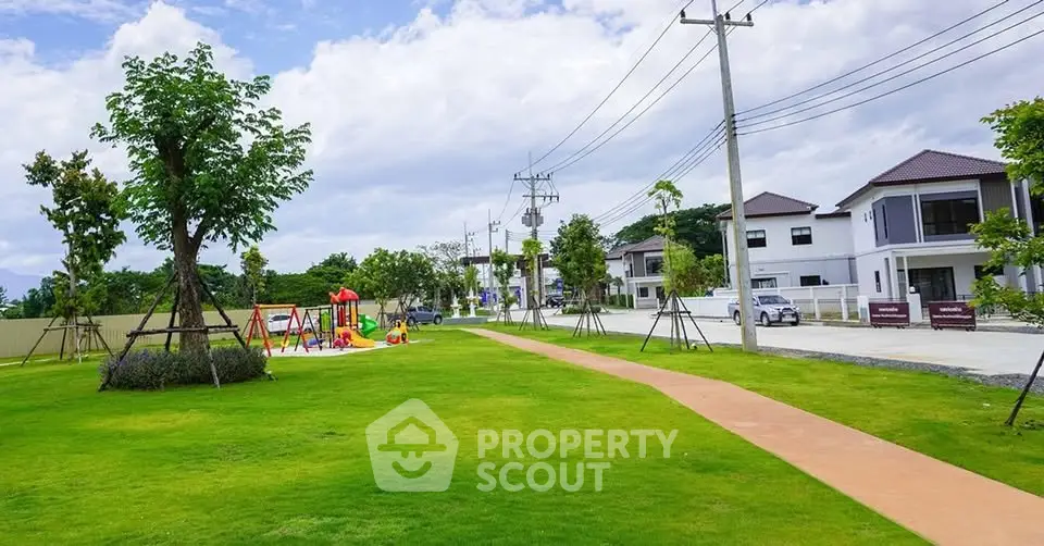 Charming suburban neighborhood with lush green park and modern homes.