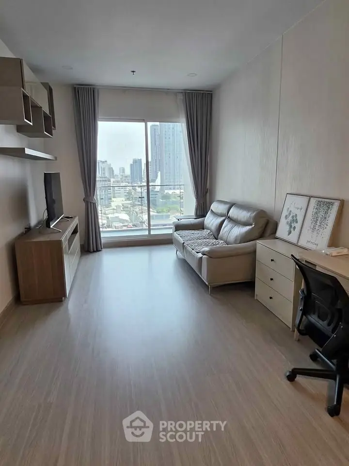 Spacious living room with city view, modern furniture, and natural light.