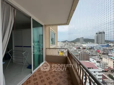 Spacious balcony with stunning city view in high-rise apartment