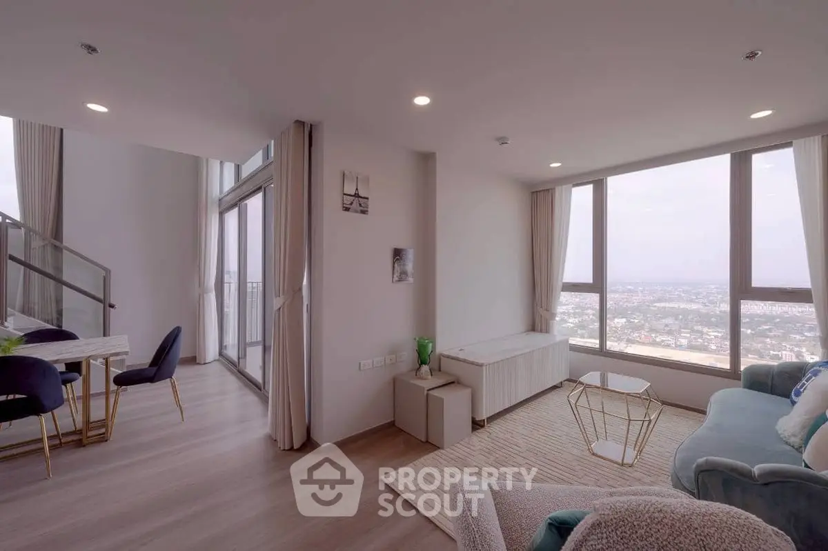 Spacious modern living room with panoramic city view and elegant decor