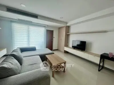 Modern living room with sleek furniture and natural light