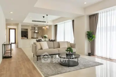 Spacious modern living room with open kitchen and elegant decor