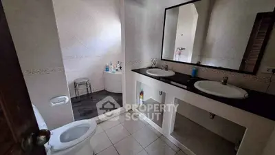 Spacious bathroom with dual sinks and modern fixtures
