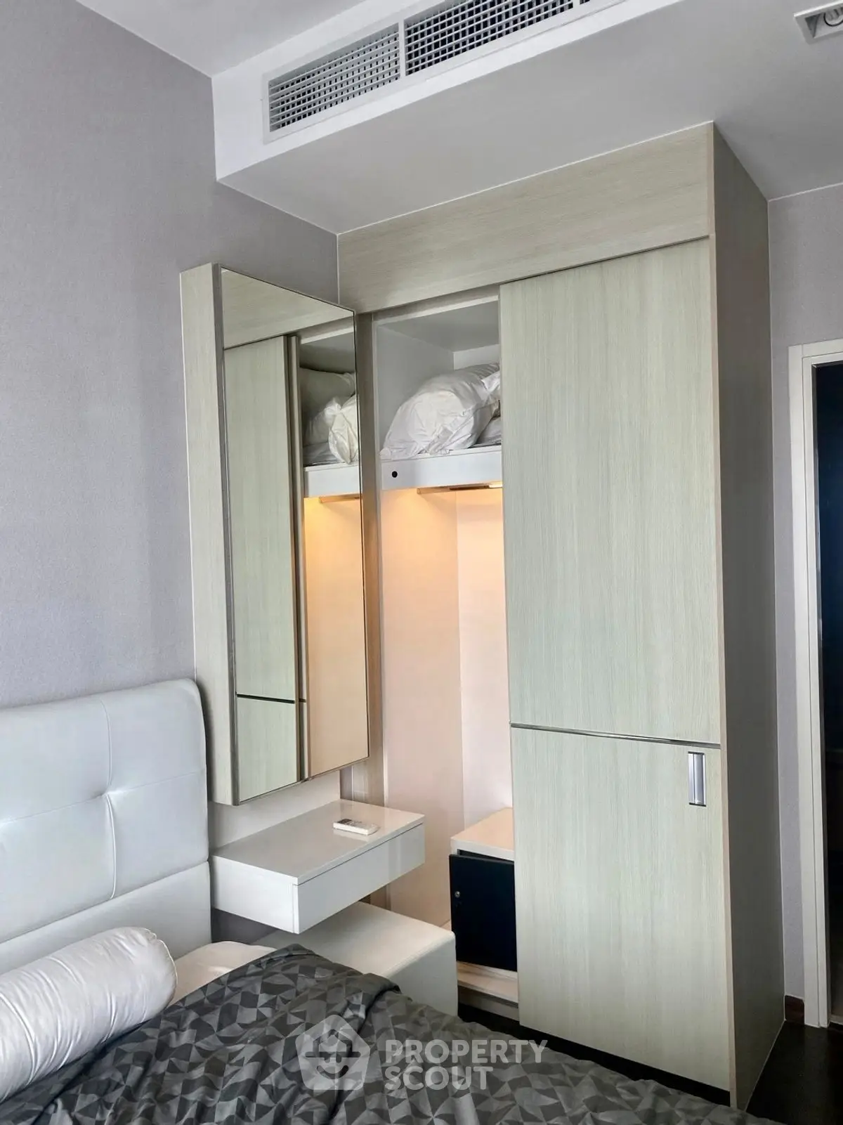 Modern bedroom with sleek wardrobe and stylish decor