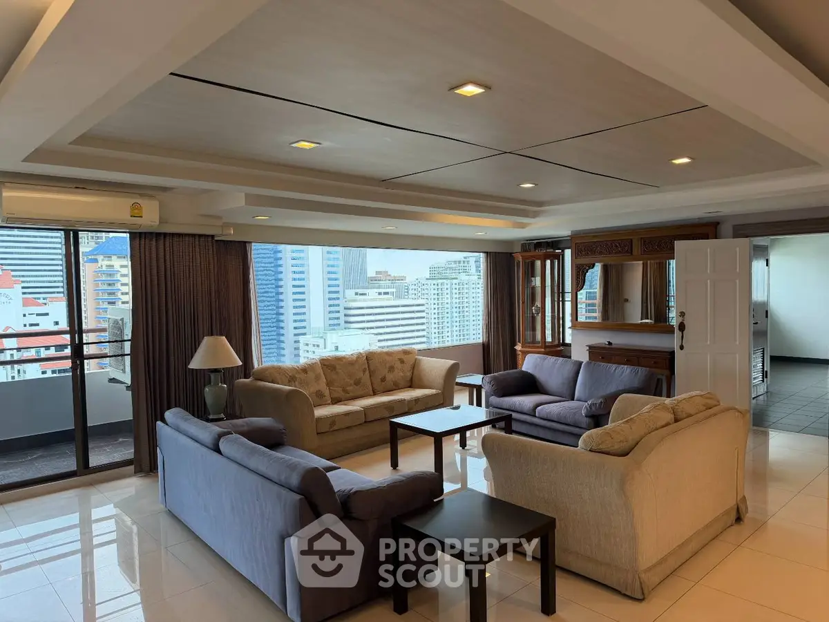 Spacious living room with city view and elegant furniture in high-rise apartment