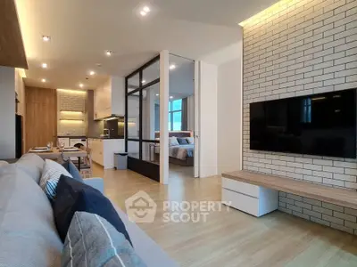 Modern open-plan living room with stylish decor and natural light