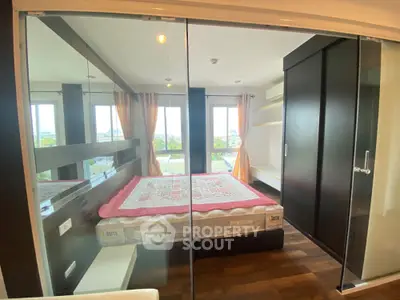 Modern bedroom with large windows and stylish decor