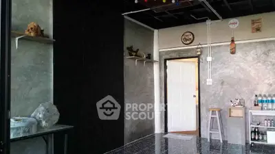 Stylish industrial-themed room with concrete walls and eclectic decor