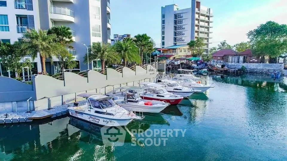 Scenic waterfront property with modern architecture and docked boats, offering serene views and luxury living.
