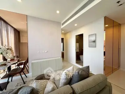 Modern living room with elegant dining area and stylish decor in a contemporary apartment.
