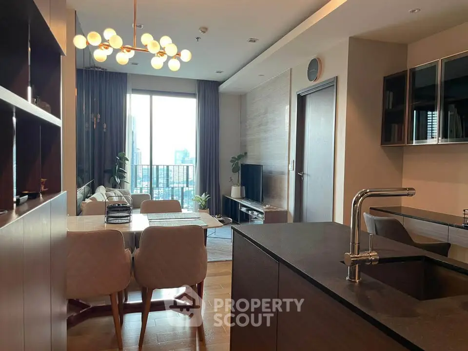 Modern living room with open kitchen and city view balcony in luxury apartment