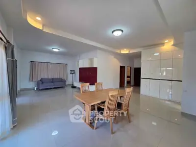 Spacious modern living room with elegant dining area and stylish furniture
