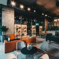 Modern living room with stylish furniture and ambient lighting in an open layout design.