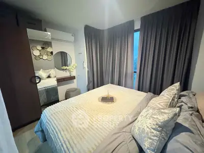 Cozy and modern bedroom with stylish decor and ample natural light.