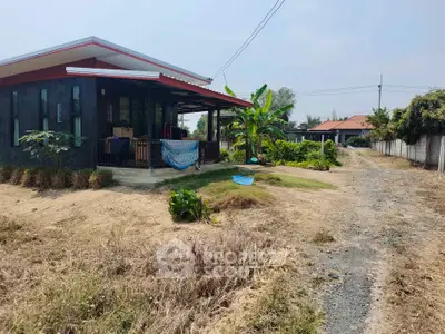 Charming rural house with spacious yard and lush greenery, perfect for serene living.