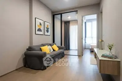 Modern living room with stylish decor and cozy seating in a contemporary apartment.