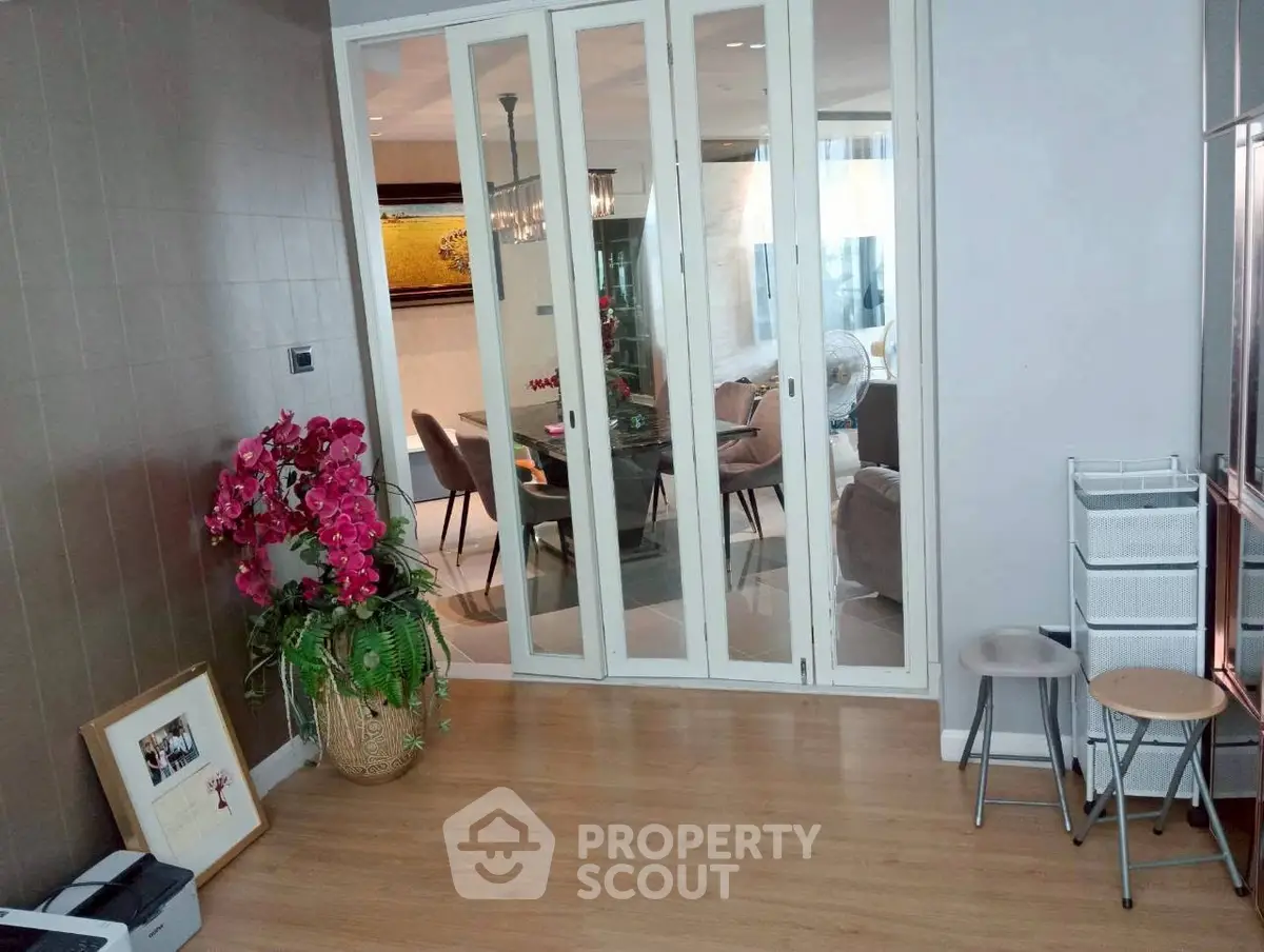Spacious living area with sliding glass doors and elegant decor