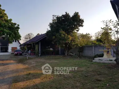 Charming countryside home with spacious garden and lush greenery, perfect for serene living.