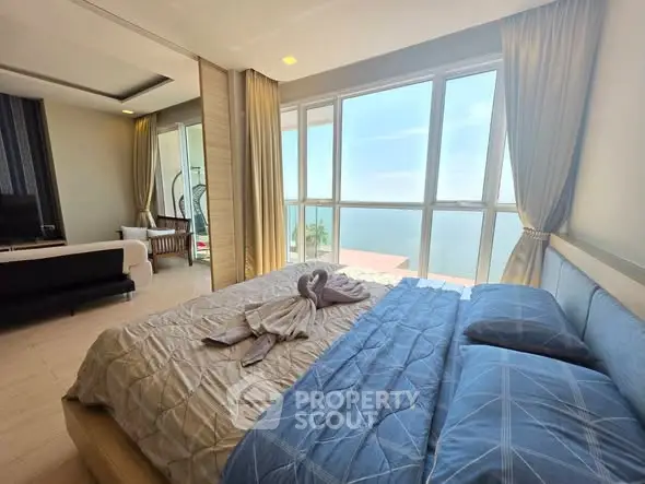 Luxurious bedroom with stunning ocean view and elegant decor