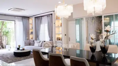 Luxurious living room with elegant chandelier and modern decor