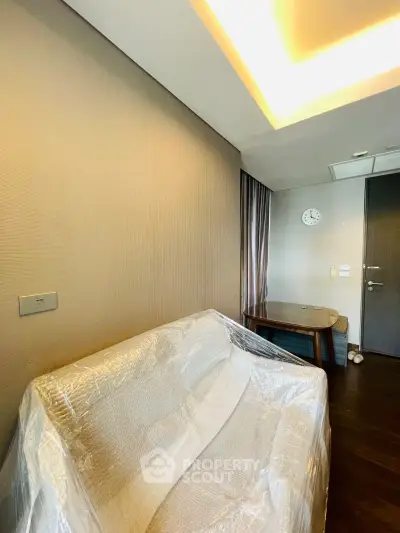 Modern living room with sleek furniture and ambient lighting, showcasing a stylish and cozy interior design.