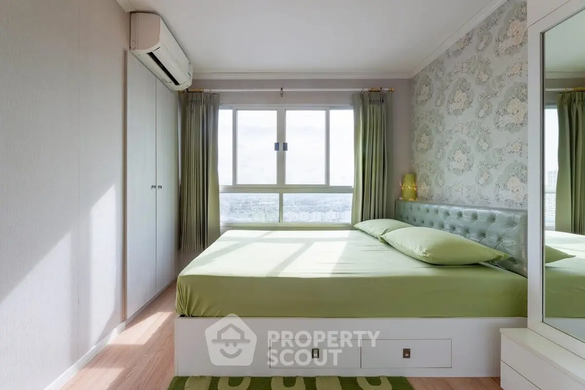 Bright and airy bedroom with large window and stylish decor